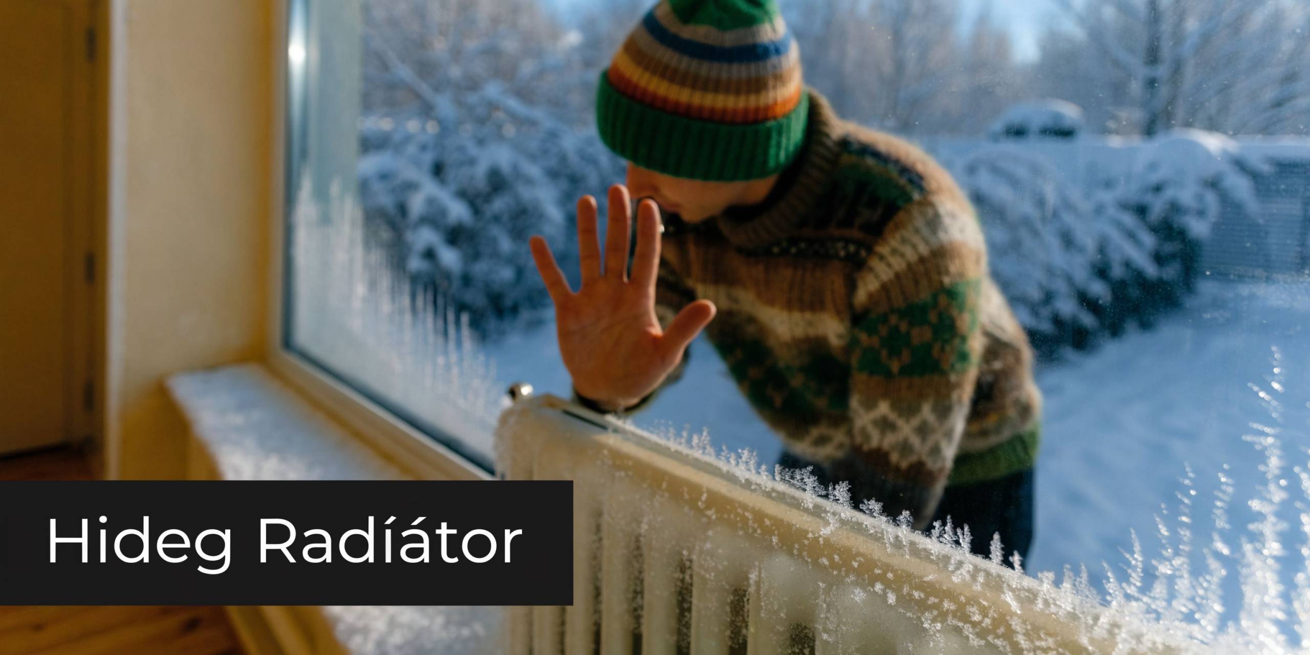 Egy fázós férfi próbál megmelegedni a hideg radiátornál egy hideg, havas téli napon otthonában.