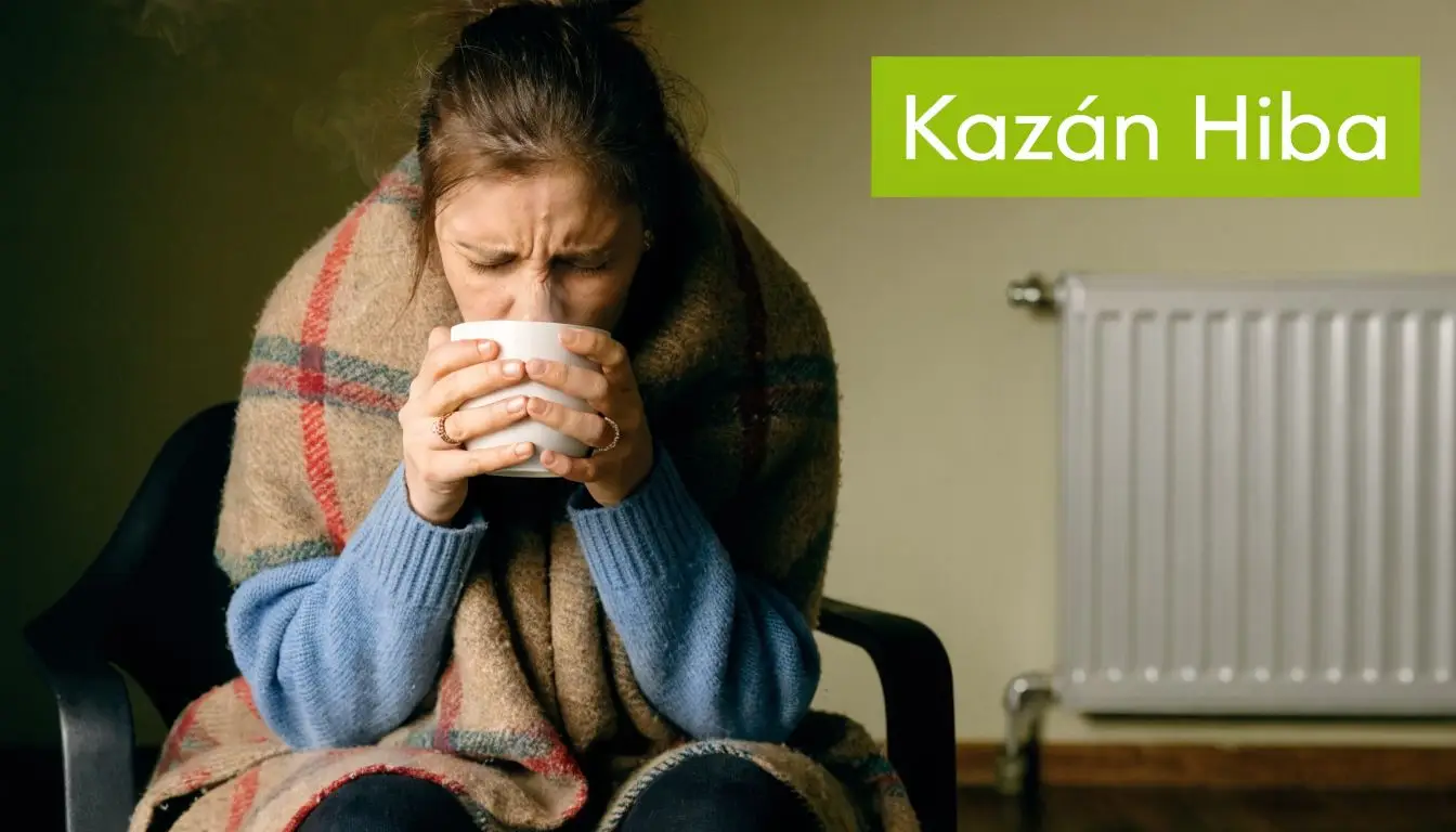 Egy fázó nő takaróba burkolózva meleg italt iszik, miközben a lakásban meghibásodott a fűtés és a kazán.